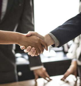 Business people shaking hands in a meeting room