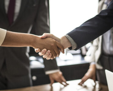 Business people shaking hands in a meeting room